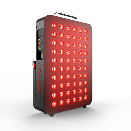 Man using BQ60 red light therapy device at bedside, showcasing red LED panel in use.