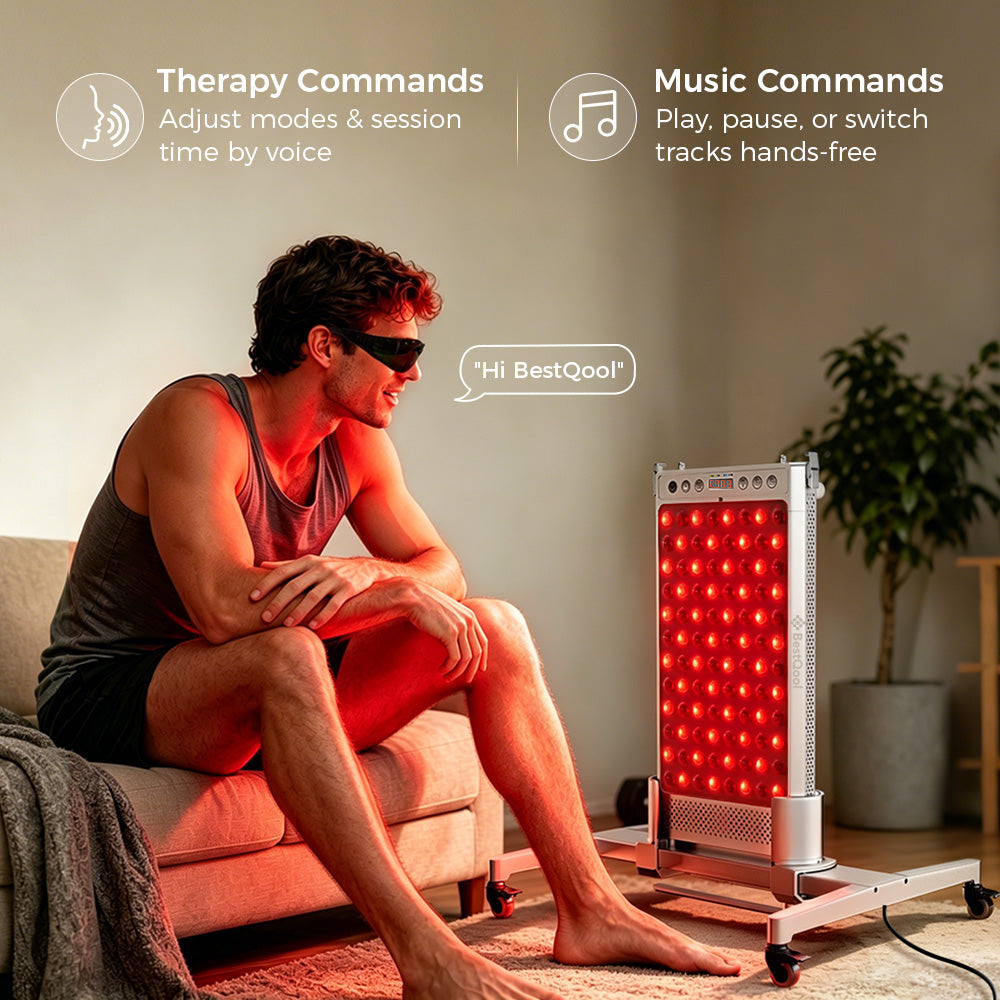 Man wearing goggles relaxing on a couch, using hands-free voice commands to control a BestQool waterproof sauna red light therapy panel on a wheeled stand.
